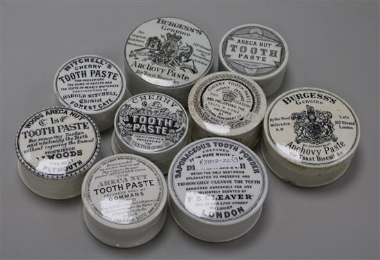 Nine Victorian circular pot lids with bases, including toothpaste and anchovy paste,